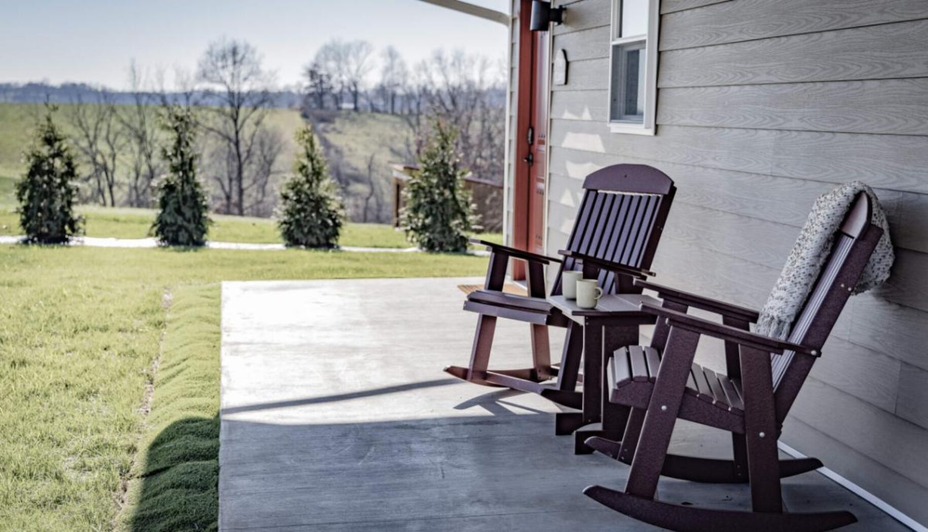 Rocking chair in front of house at Floret Hill
