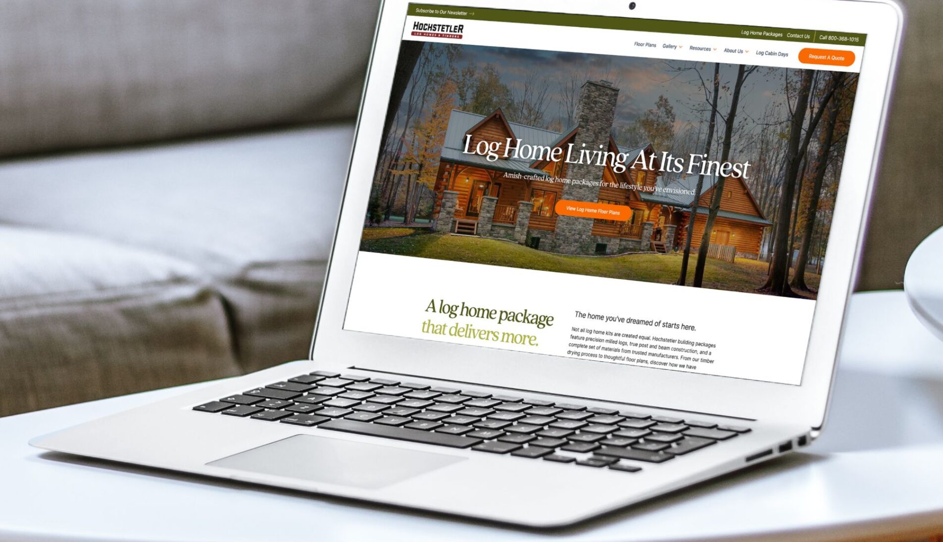 Hochstetler Log Homes website displayed on MacBook Air