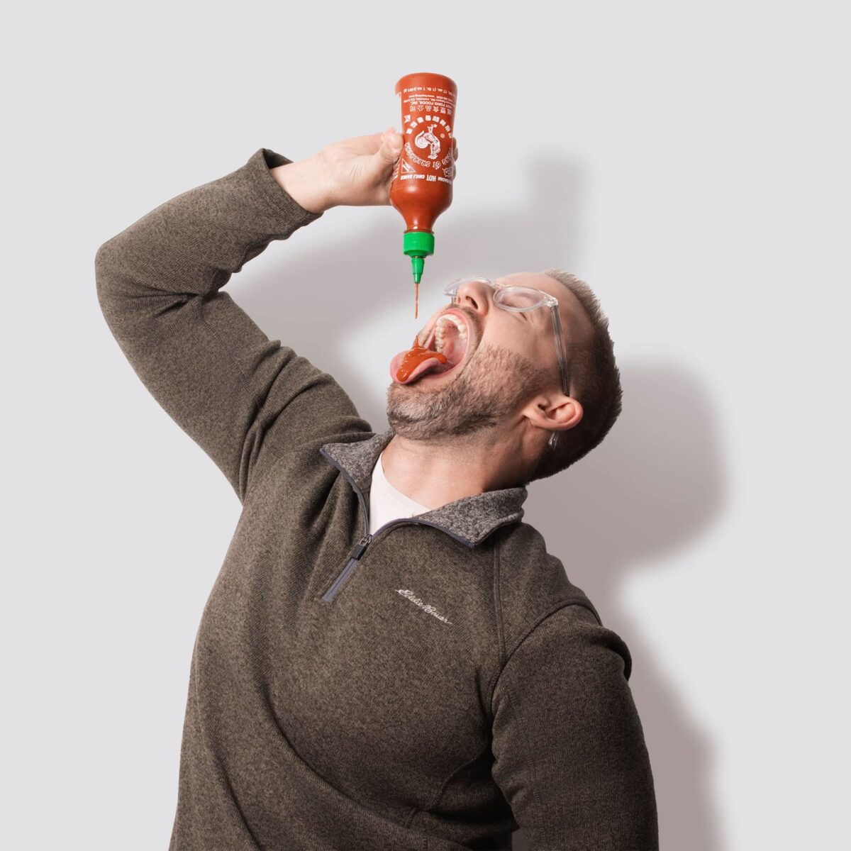 Dave Lamp guzzling Sriracha