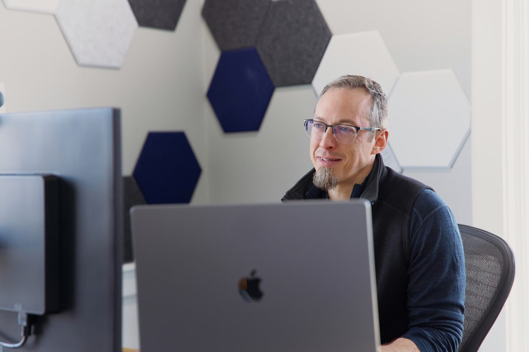 About Cassel Bear: Karl Bear working at a computer in the Canton, OH office.